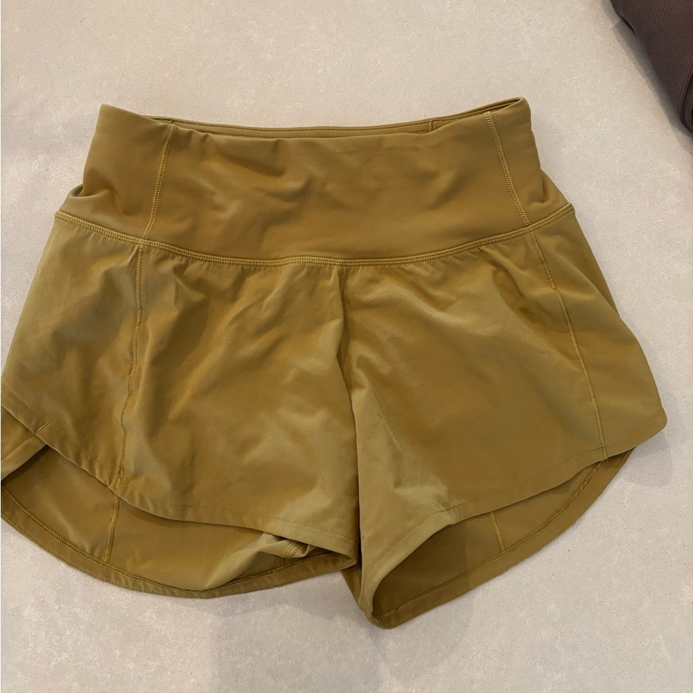Lululemon Athletica Tan/Olive Speed Up high rise shirts.  Size 0 tall.